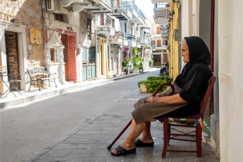 Chios Greece Street View From Pyrgi Chios Island Geece With Woman Which Sitting Chair