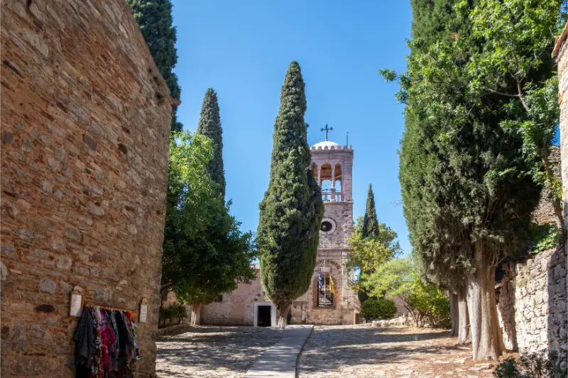 Nea Monastery Courtyard Chios Island Greece Cypress Trees Stone Walls Quiet Garden Blue Sky