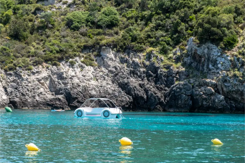 Pedal Boat Like Car Floating Turquoise Sea Near Rocky Cliffs Corfu Island Greece