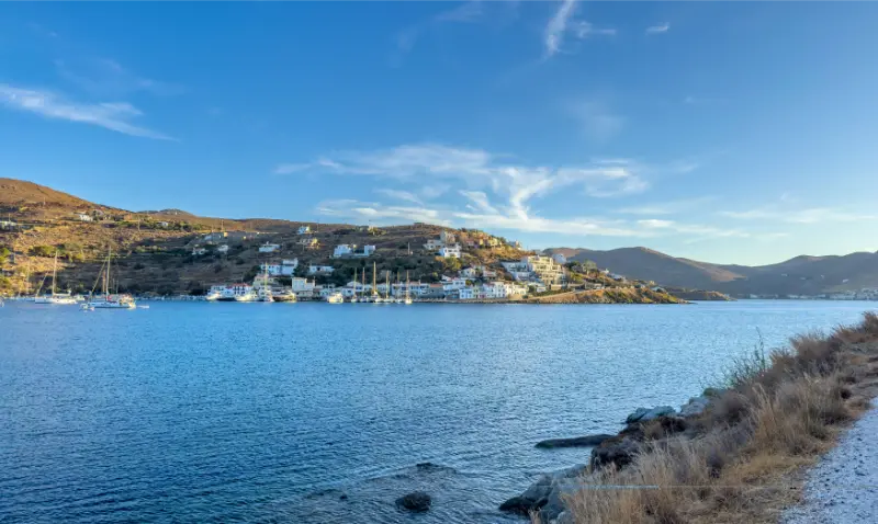 Scenic View Coastal Village Marina Within Vourkari Kea Tzia Greece Captured Sunset Featuring Calm Blue Waters Moored Sailboats Hillside